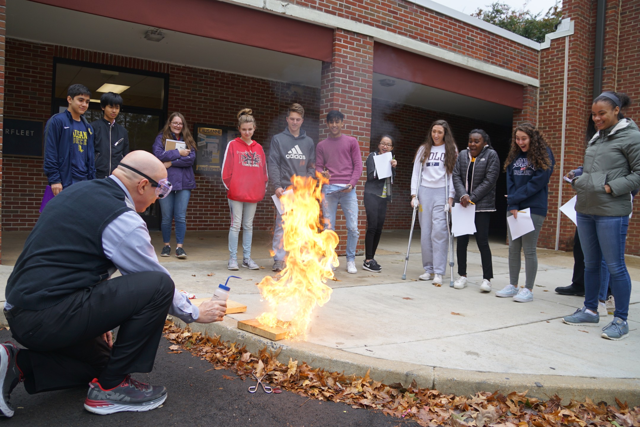 Teacher lighting flame