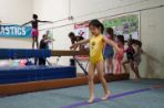 Girl in yellow engaging in gymnastics