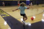Student kicking ball in kickball game