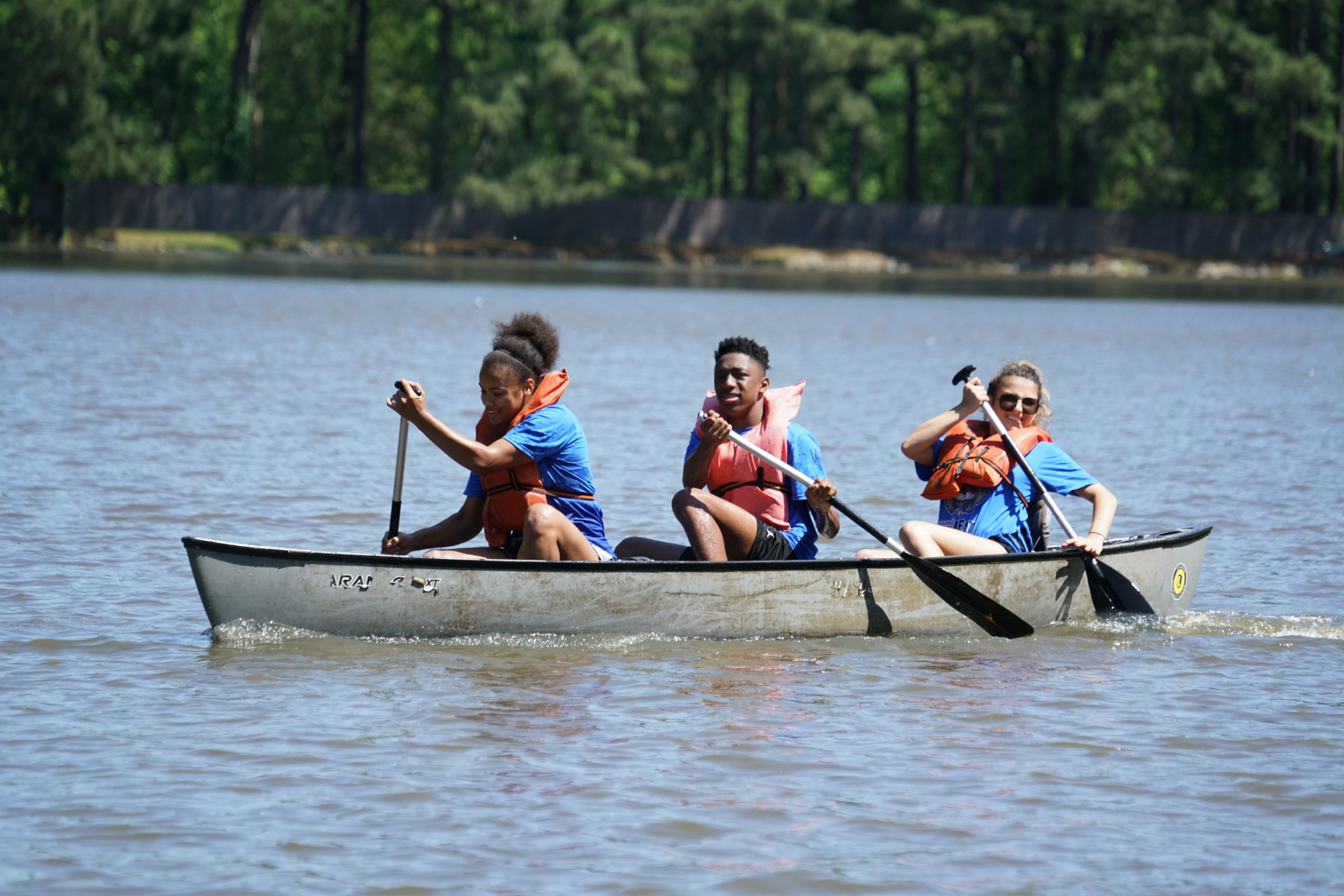 Students canoeing on lake